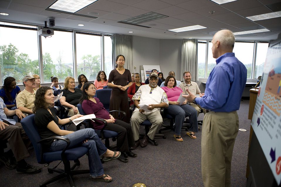 16449-men-and-women-at-a-town-hall-meeting-pv