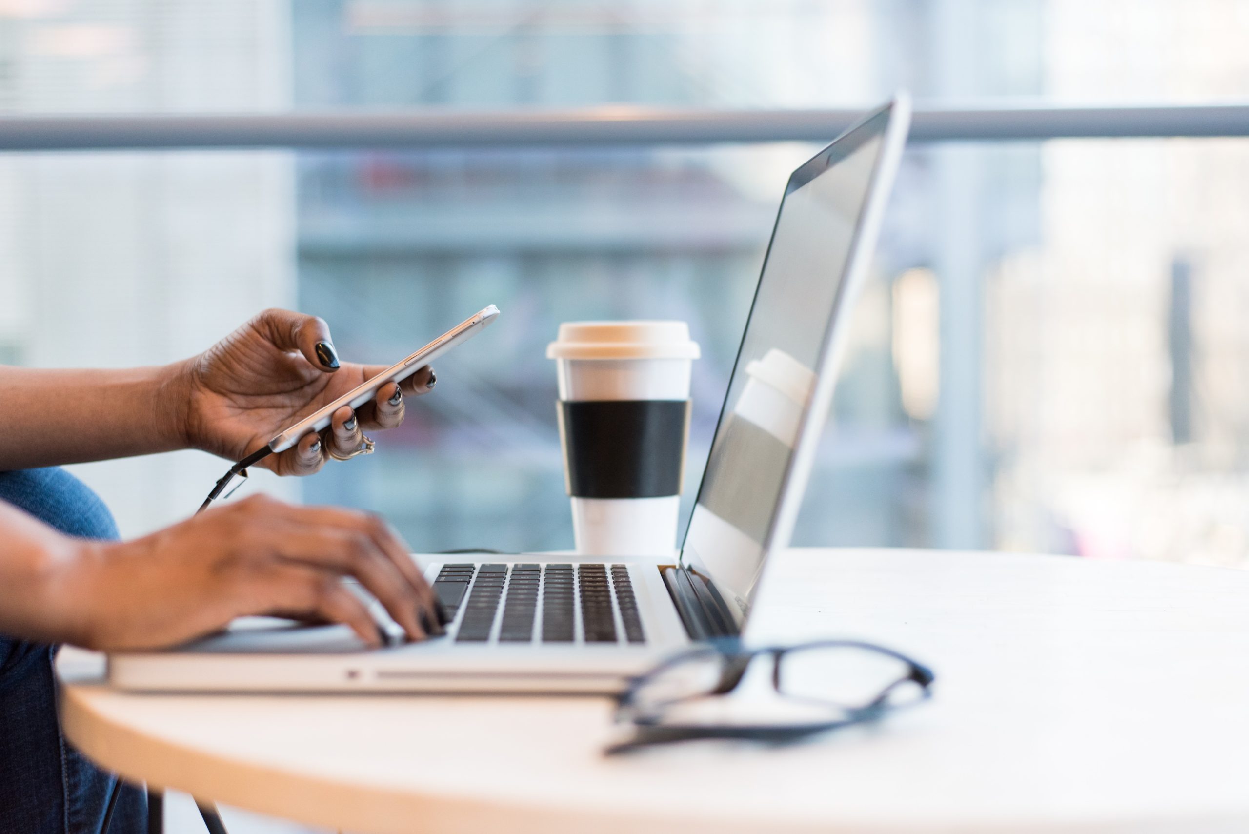 person-using-macbook-air-on-table