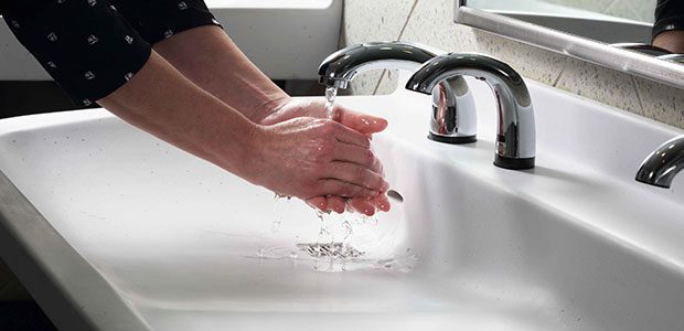 Person Washing Hands Using Autosoap